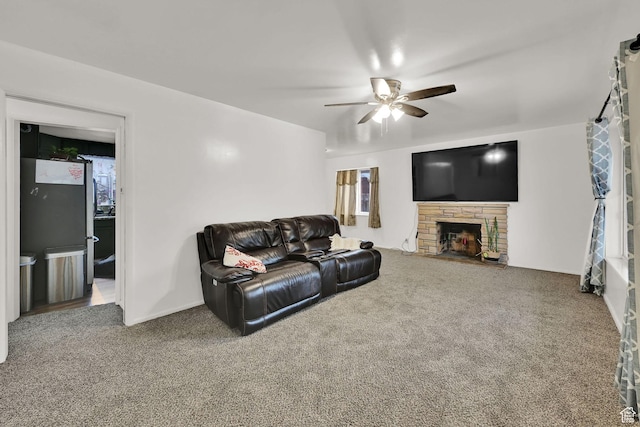 3347 S Rulon St W, Magna, UT 84044 - living area with a ceiling fan, carpet, and a fireplace