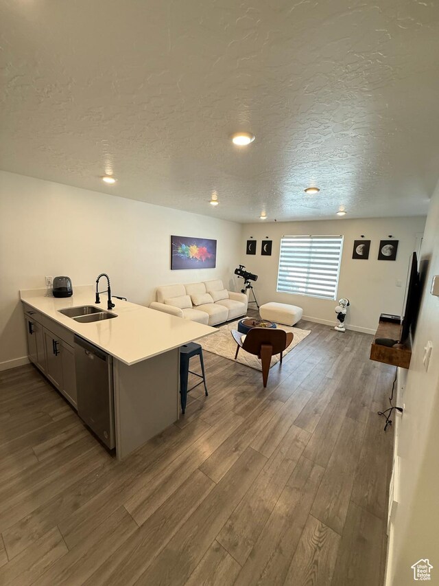 1144 E Trident Dr S, Saratoga Springs, UT 84045 - living area featuring dark wood-type flooring, a textured ceiling, and recessed lighting