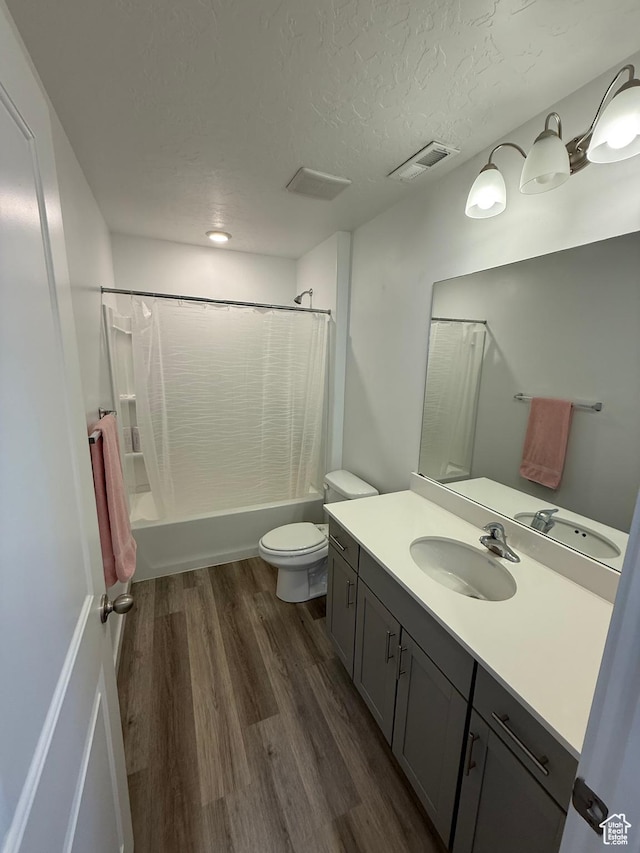 1144 E Trident Dr S, Saratoga Springs, UT 84045 - full bathroom with vanity, shower / bathtub combination with curtain, wood finished floors, and a textured ceiling