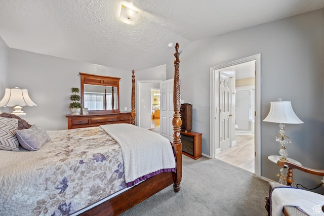 5149 W Village Wood Dr, West Valley City, UT 84120 - bedroom featuring ensuite bathroom, light colored carpet, and a textured ceiling