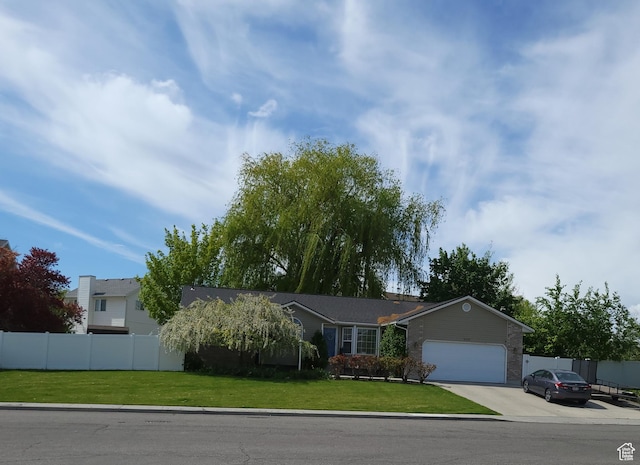 5149 W Village Wood Dr, West Valley City, UT 84120 - view of front of home featuring a garage and concrete driveway