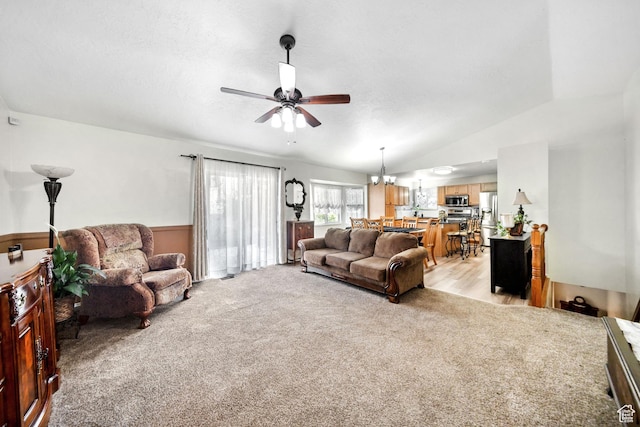 5149 W Village Wood Dr, West Valley City, UT 84120 - living room featuring a ceiling fan, light colored carpet, a chandelier, and lofted ceiling