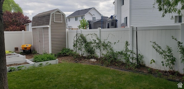 5149 W Village Wood Dr, West Valley City, UT 84120 - fenced backyard with a vegetable garden and a storage shed