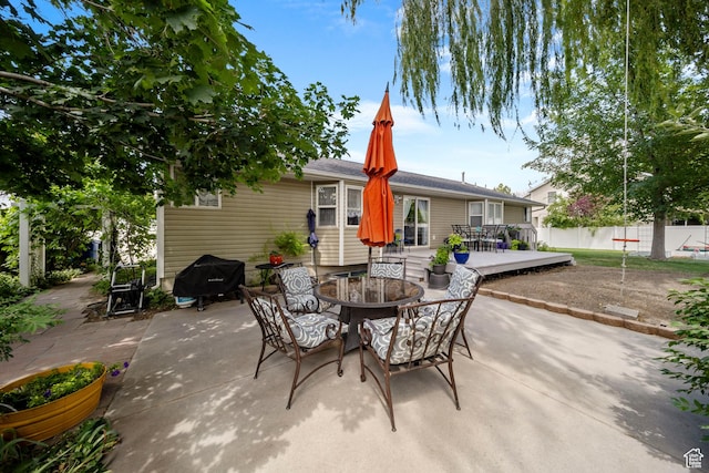 5149 W Village Wood Dr, West Valley City, UT 84120 - view of patio / terrace featuring grilling area, outdoor dining space, and a wooden deck