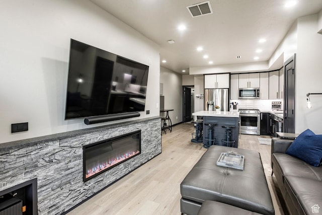 6627 Mountain Alder Way, Park City, UT 84098 - living room with light wood finished floors, a fireplace, and recessed lighting