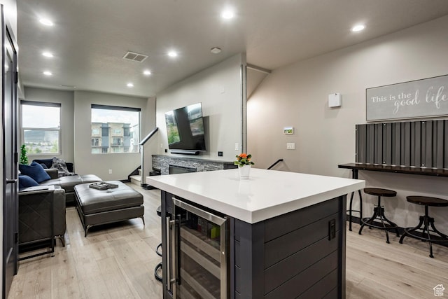 6627 Mountain Alder Way, Park City, UT 84098 - kitchen featuring beverage cooler, light wood-style floors, open floor plan, recessed lighting, and light countertops