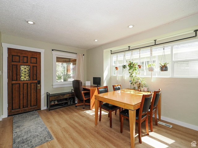 320 E Hollywood Ave S, Salt Lake City, UT 84115 - dining space with light wood-type flooring, a textured ceiling, and recessed lighting