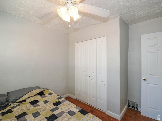 320 E Hollywood Ave S, Salt Lake City, UT 84115 - bedroom with wood finished floors, a closet, ceiling fan, and a textured ceiling