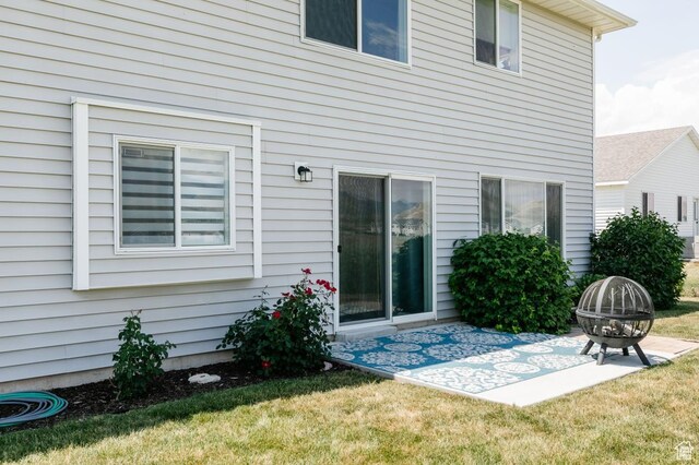 659 S Lakeside Dr, Franklin, ID 83237 - rear view of house with an outdoor fire pit, a patio, and a yard