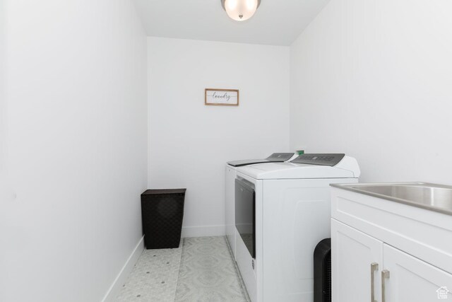 659 S Lakeside Dr, Franklin, ID 83237 - laundry area with washer and clothes dryer and cabinet space
