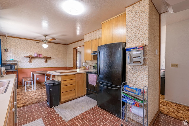570 N 400 W, Logan, UT 84321 - kitchen with black appliances, brick patterned flooring, a peninsula, a ceiling fan, and light countertops