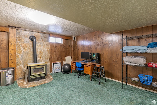 570 N 400 W, Logan, UT 84321 - carpeted office with a textured ceiling, a wood stove, and wooden walls