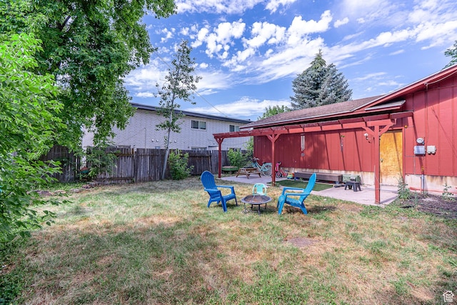 570 N 400 W, Logan, UT 84321 - fenced backyard featuring an outdoor fire pit and a patio area