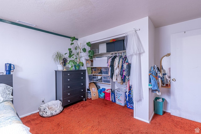 570 N 400 W, Logan, UT 84321 - carpeted bedroom featuring a closet and a textured ceiling