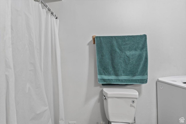1124 S 1000 E Unit 3, Provo, UT 84606 - bathroom with washer / dryer, vanity, and a shower with curtain