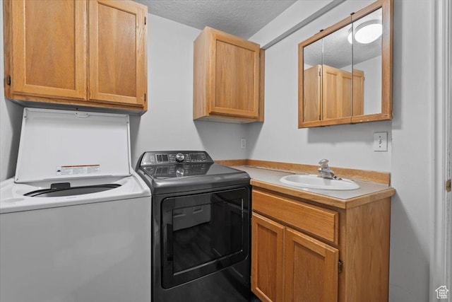 1124 S 1000 E Unit 3, Provo, UT 84606 - laundry area featuring cabinet space, washing machine and dryer, and a textured ceiling