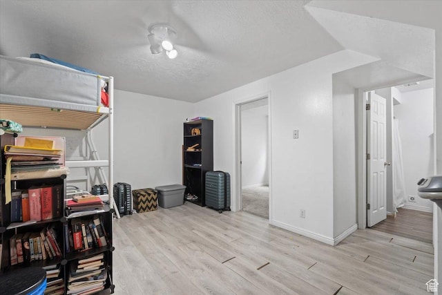 1124 S 1000 E Unit 3, Provo, UT 84606 - bedroom with light wood-type flooring and a textured ceiling
