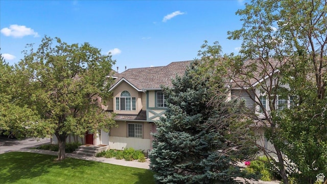 1124 S 1000 E Unit 3, Provo, UT 84606 - view of front of home with a front yard, roof with shingles, and stucco siding
