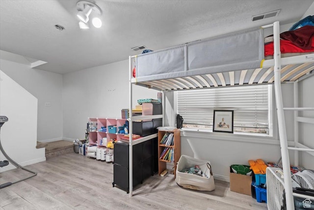 1124 S 1000 E Unit 3, Provo, UT 84606 - bedroom with wood finished floors and a textured ceiling