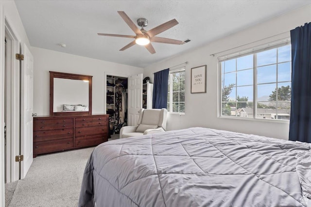 1124 S 1000 E Unit 3, Provo, UT 84606 - bedroom featuring carpet, ceiling fan, a walk in closet, and a closet
