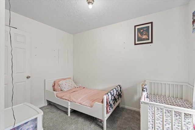 1124 S 1000 E Unit 3, Provo, UT 84606 - carpeted bedroom with a textured ceiling and baseboards
