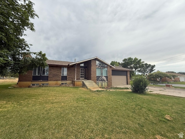 159 W 8800 S, Spanish Fork, UT 84660 - view of front of property featuring brick siding, a front yard, and an attached garage
