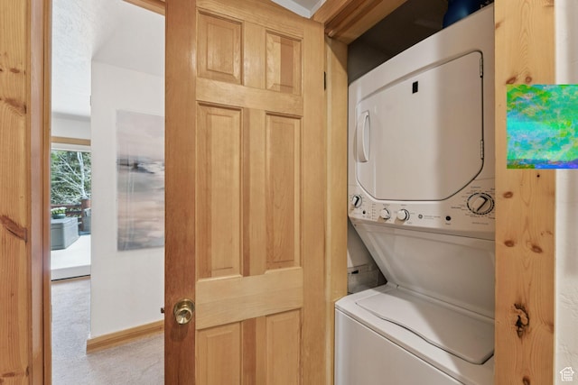 1955 Deer Valley Dr N Unit 302, Park City, UT 84060 - washroom with stacked washer and clothes dryer