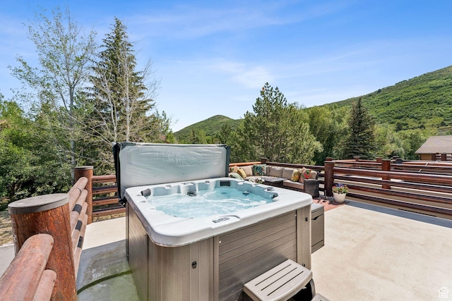 1955 Deer Valley Dr N Unit 302, Park City, UT 84060 - deck with a hot tub, a view of trees, and a mountain view