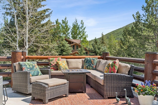 1955 Deer Valley Dr N Unit 302, Park City, UT 84060 - view of patio / terrace featuring a mountain view and an outdoor living space with a fire pit
