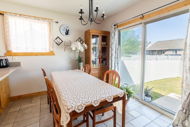 4091 W Juniper Hills Dr, South Jordan, UT 84095 - dining area with a chandelier and baseboards