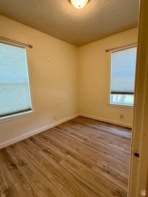 624 N 500 W, Vernal, UT 84078 - empty room featuring wood finished floors and a textured ceiling