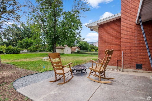 784 Lavina Dr, South Ogden, UT 84403 - view of patio / terrace featuring an outdoor fire pit and a shed