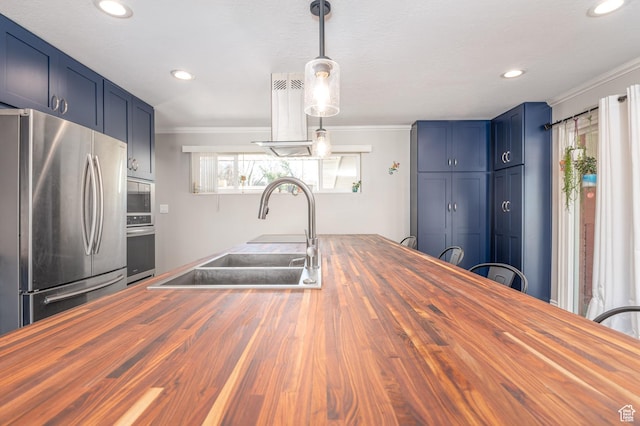 784 Lavina Dr, South Ogden, UT 84403 - kitchen with wood counters, stainless steel appliances, ornamental molding, recessed lighting, and blue cabinets