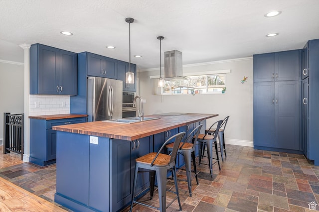 784 Lavina Dr, South Ogden, UT 84403 - kitchen featuring wooden counters, appliances with stainless steel finishes, crown molding, blue cabinetry, and recessed lighting