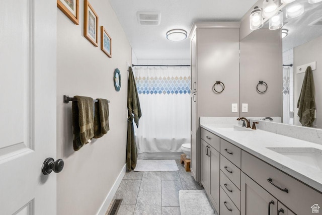 784 Lavina Dr, South Ogden, UT 84403 - full bath featuring double vanity and baseboards
