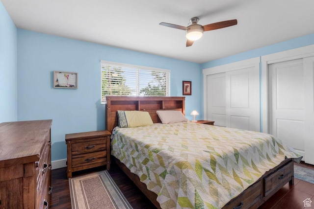 784 Lavina Dr, South Ogden, UT 84403 - bedroom featuring dark wood-type flooring, two closets, and ceiling fan