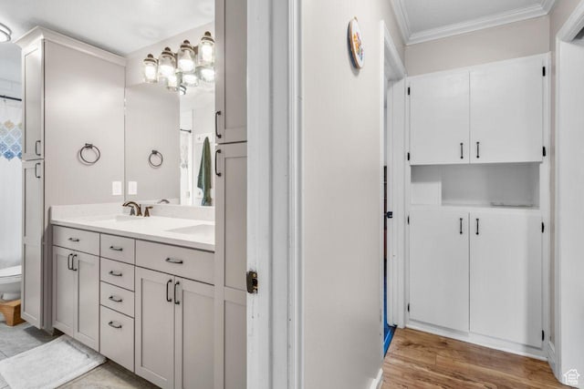 784 Lavina Dr, South Ogden, UT 84403 - full bath featuring ornamental molding, double vanity, and wood finished floors