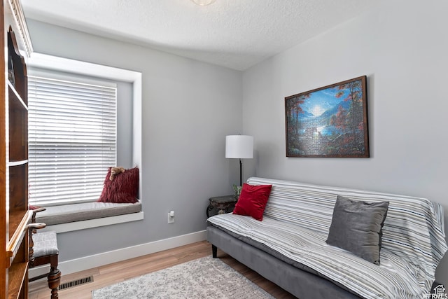 2484 W Gordon Ave, Layton, UT 84041 - sitting room featuring wood finished floors and a textured ceiling