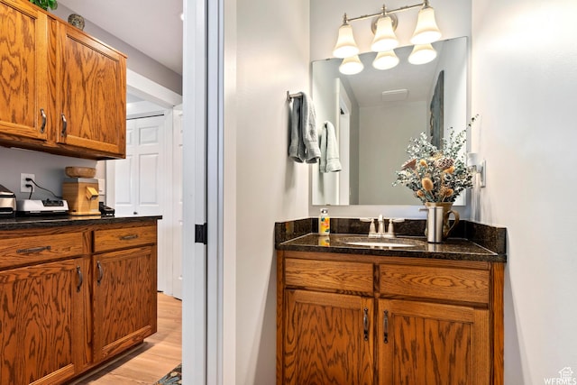 2484 W Gordon Ave, Layton, UT 84041 - bathroom with vanity and wood finished floors