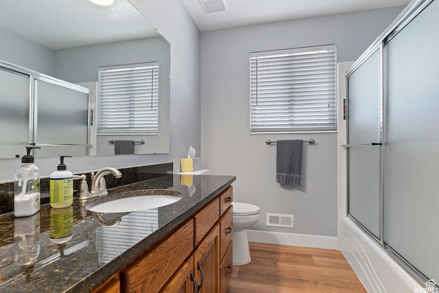 2484 W Gordon Ave, Layton, UT 84041 - bathroom with vanity, wood finished floors, and shower / bath combination with glass door