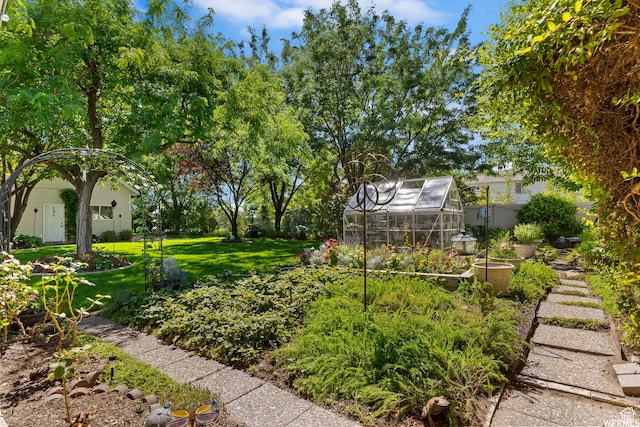 2484 W Gordon Ave, Layton, UT 84041 - view of yard featuring a greenhouse and an outdoor structure