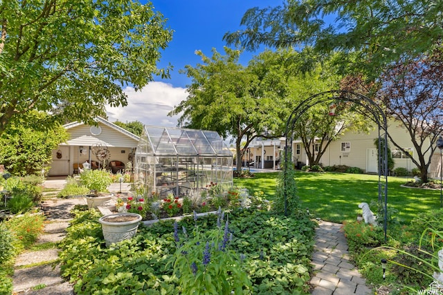 2484 W Gordon Ave, Layton, UT 84041 - view of green lawn featuring an exterior structure and an outdoor structure