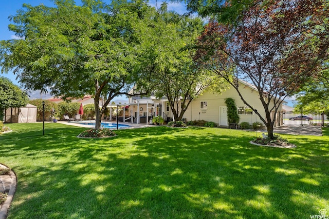 2484 W Gordon Ave, Layton, UT 84041 - view of yard with a storage shed and a patio