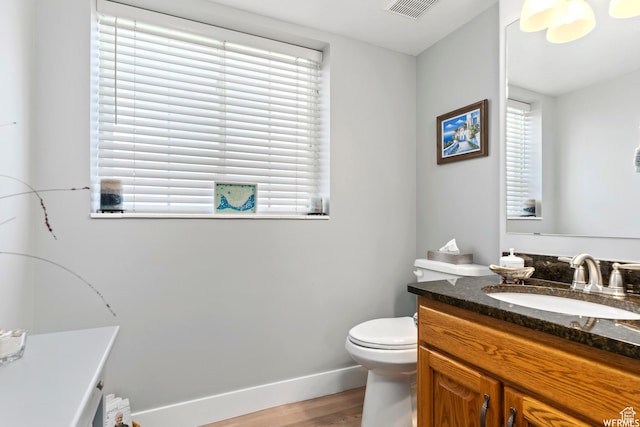 2484 W Gordon Ave, Layton, UT 84041 - bathroom featuring vanity, wood finished floors, and healthy amount of natural light