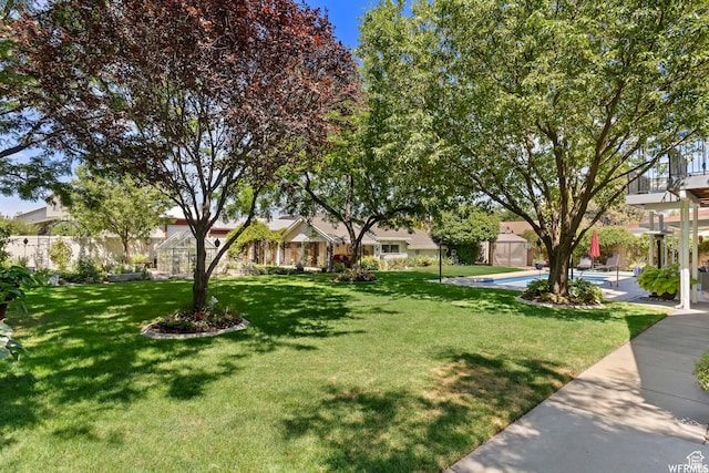 2484 W Gordon Ave, Layton, UT 84041 - view of front of home featuring a storage unit and a patio area