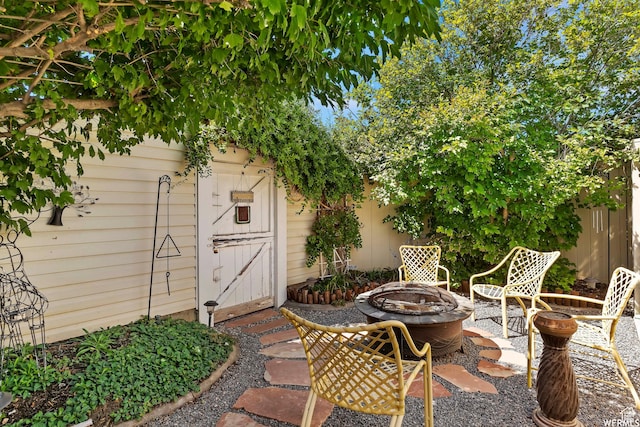 2484 W Gordon Ave, Layton, UT 84041 - view of patio / terrace featuring a fire pit