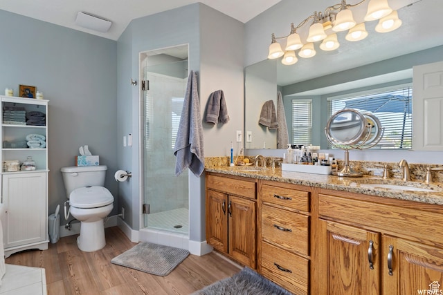 2484 W Gordon Ave, Layton, UT 84041 - bathroom with double vanity, a stall shower, and wood finished floors