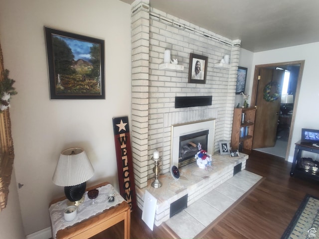217 Wilkins, East Carbon, UT 84520 - living room with wood finished floors and a brick fireplace