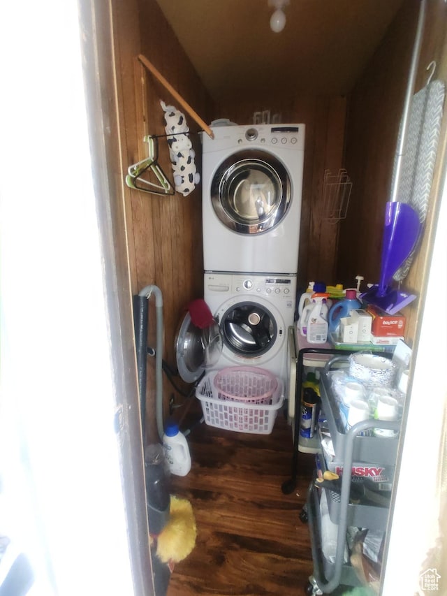 217 Wilkins, East Carbon, UT 84520 - washroom featuring stacked washer / dryer and wood finished floors