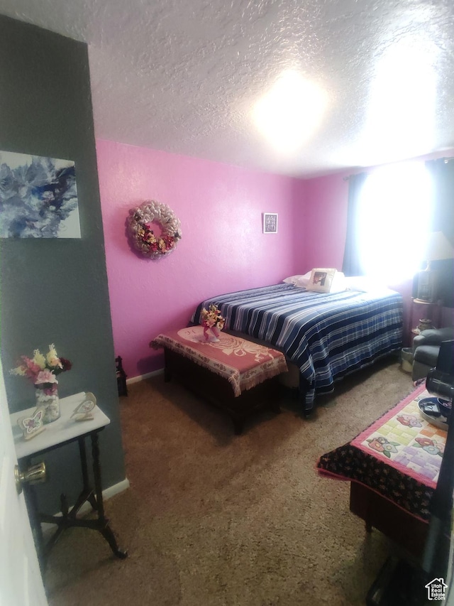 217 Wilkins, East Carbon, UT 84520 - carpeted bedroom with a textured ceiling